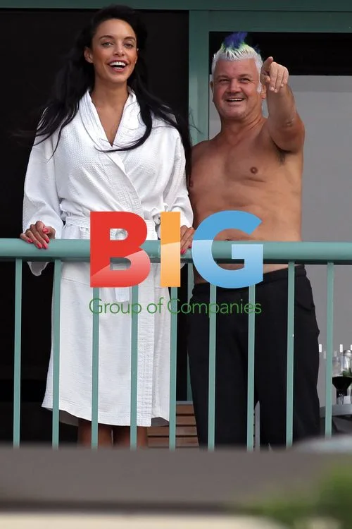 Darryn Lyons shows off Abs on hotel balcony
