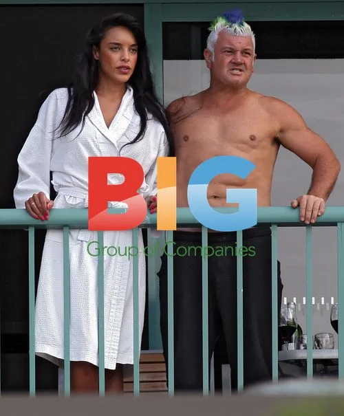 Darryn Lyons Flaunts Abs on Hotel Balcony