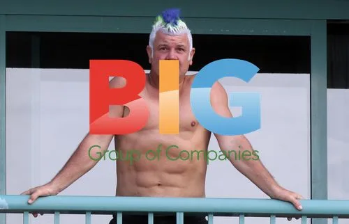 Darryn Lyons Shows Off Abs on Hotel Balcony