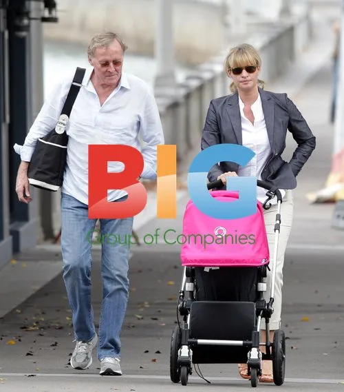 Kristy Hinze and family out with newborn