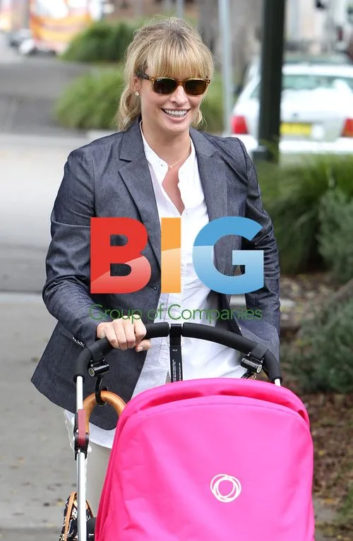 Kristy Hinze and Jim Clark with newborn