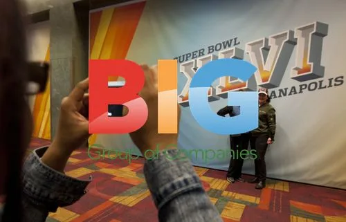 Fans Posing with Super Bowl XLVI Logo