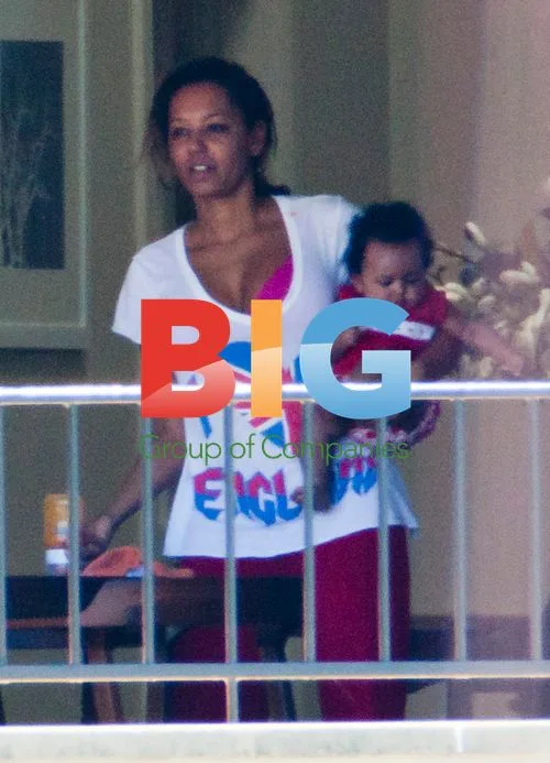 Melanie Brown and Family on Balcony