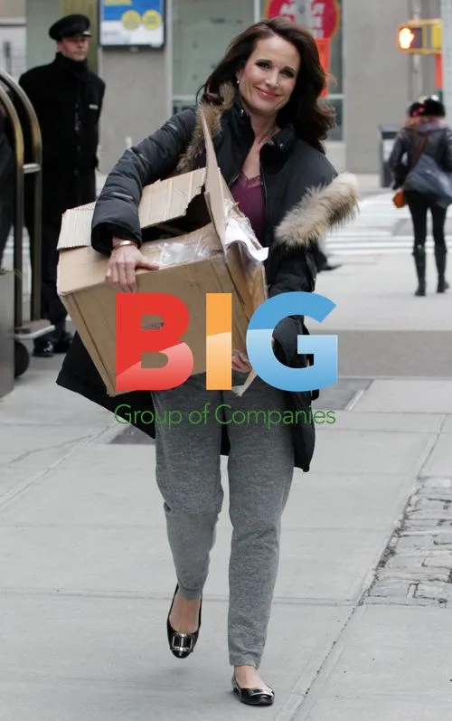 Andie MacDowell Leaves Hotel with Box
