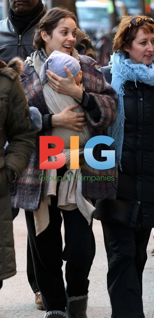 Marion Cotillard with baby on movie set
