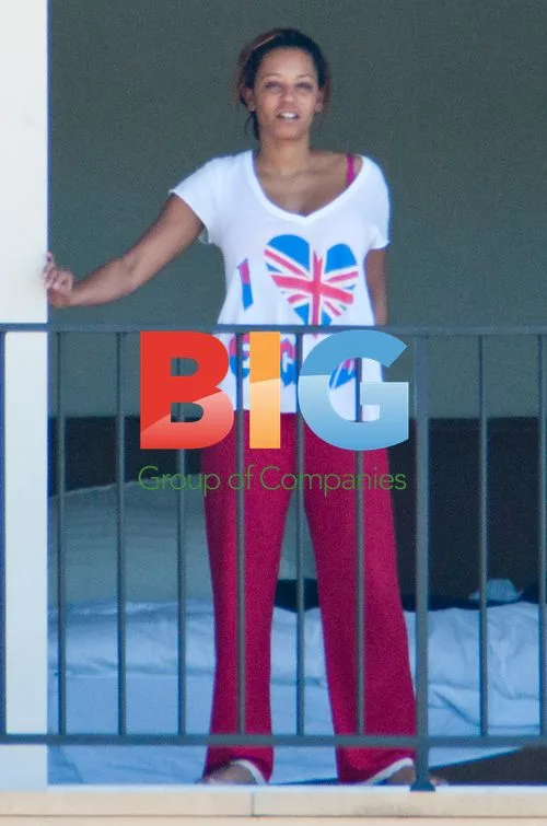 Melanie Brown and family on balcony