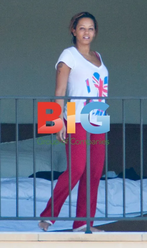 Melanie Brown with family on balcony