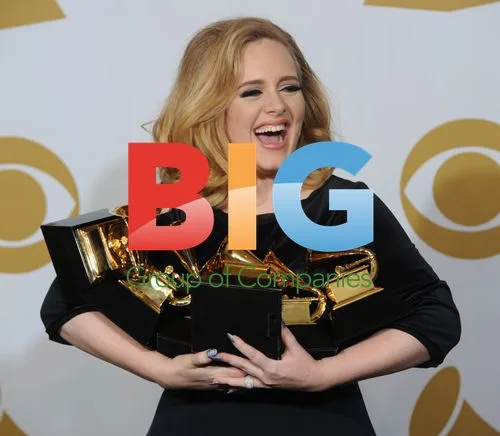 Adele Cradles Grammy Awards at 54th Grammys