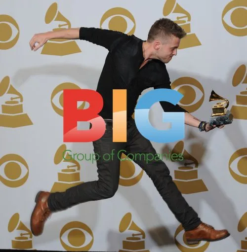 Ryan Tedder leaps with Grammy backstage