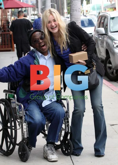 Amanda Michalka Laughs With Homeless Man