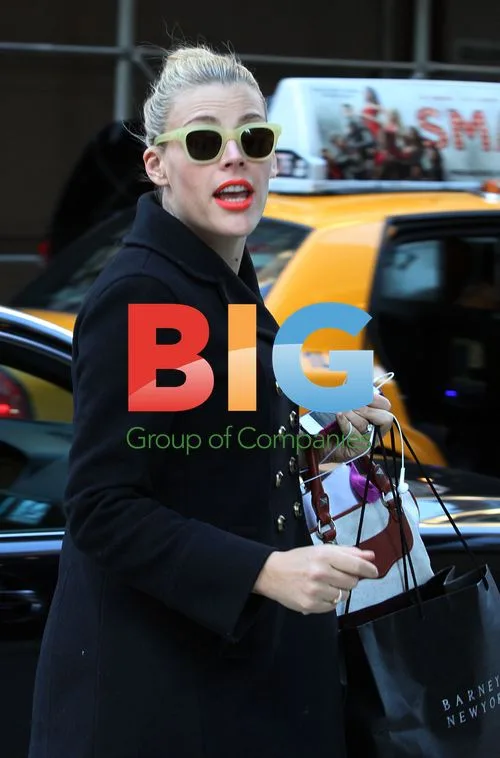 Busy Philips Arrives at NYC Hotel