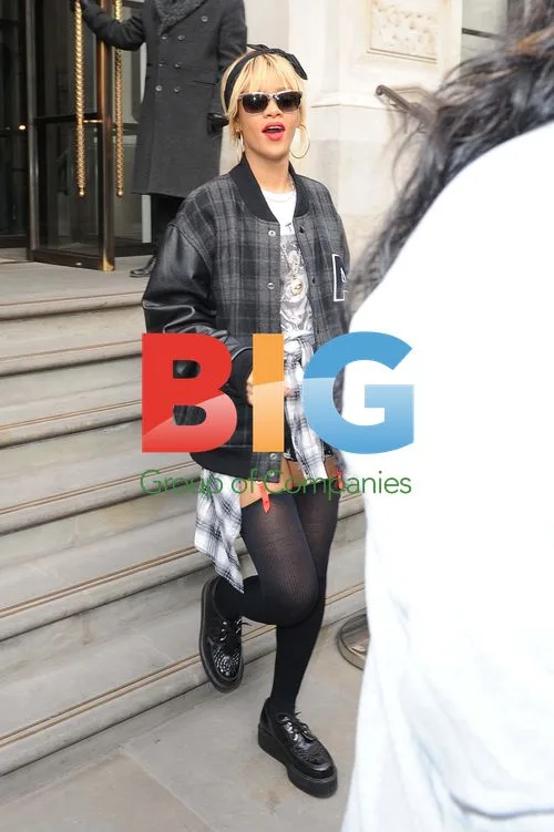Rihanna Leaves Hotel, Hugs Fans