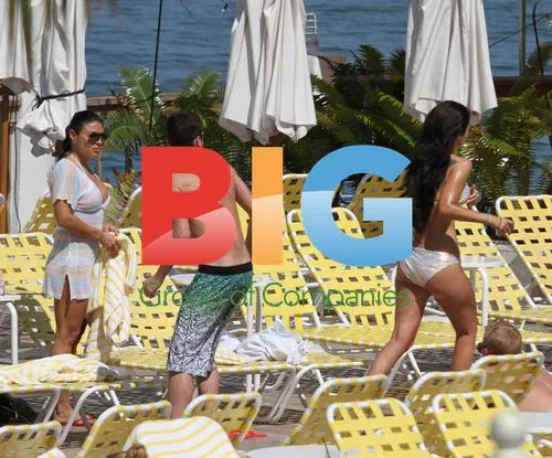 Tulisa Contostavlos relaxes by Miami hotel pool