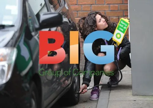 Singer Eliza Doolittle with car at petrol station