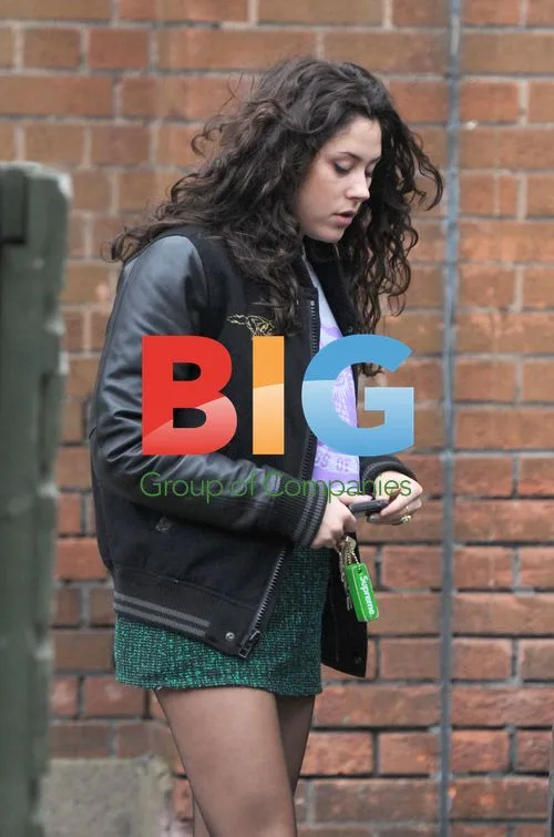 Singer Eliza Doolittle fueling car