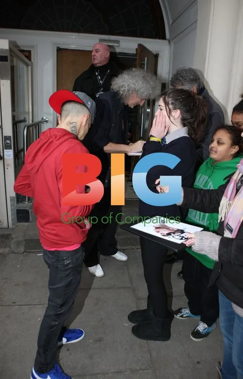 Dappy and Brian May perform 'We Will Rock You'