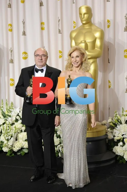 Dante Ferretti and Francesca Lo Schiavo with Oscars