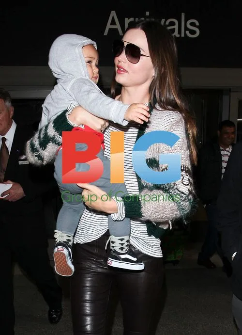 Miranda Kerr arrives at LAX with son Flynn