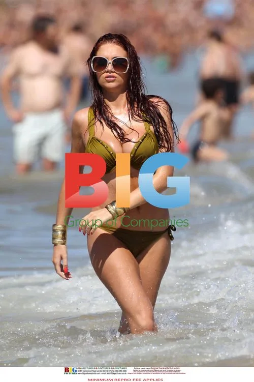 Amy Childs in Green Bikini by the Sea