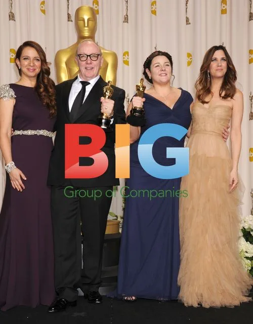 Maya Rudolph, Terry George, Oorlagh George and Kristen Wiig at the 84th Oscars