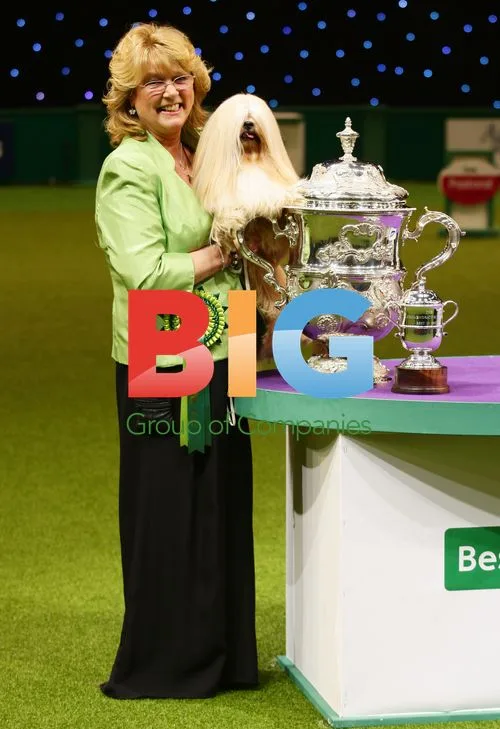 Woman with Lhasa Apso Dog at Crufts 2012