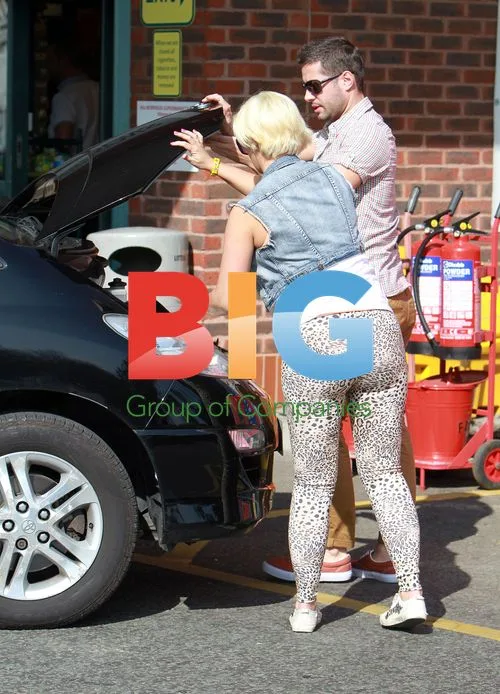 Kerry Katona Stops for Car Maintenance