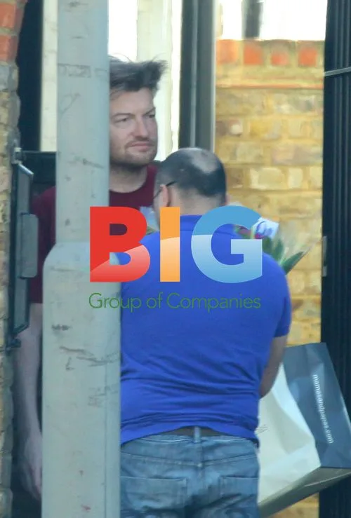 Charlie Brooker Receives Flowers at Home