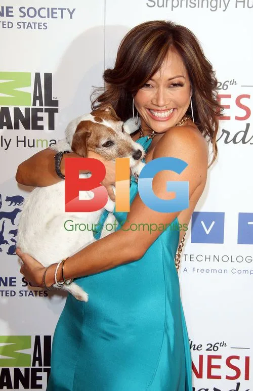 Carrie Ann Inaba and Uggie at The 26th Genesis Awards