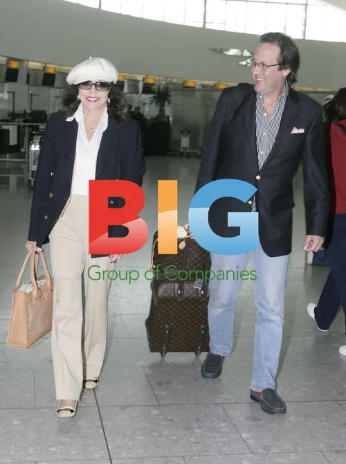 Joan Collins and husband depart Heathrow