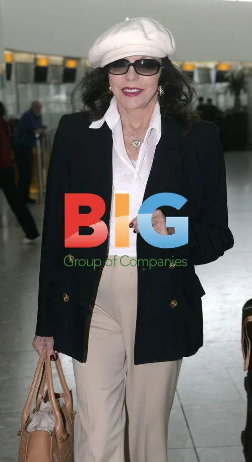 Joan Collins and Husband Depart Heathrow