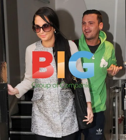 Singer Tulisa Leaves Office with PA