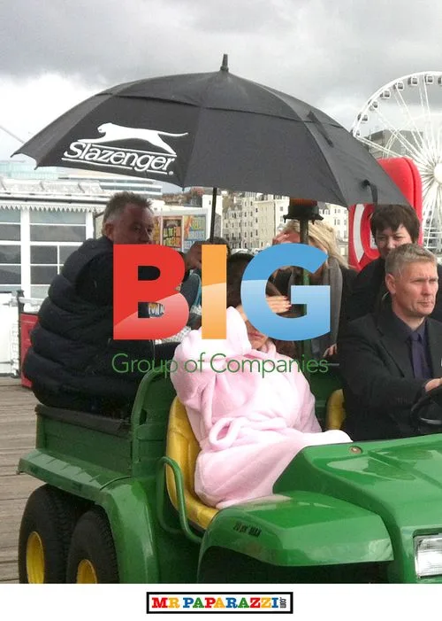 Kelly Brook Shelters from Rain in Brighton