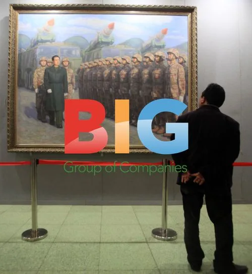 Chinese man views painting of Hu Jintao and Chinese military