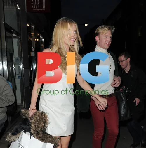 Henry Conway and Laura Whitmore leaving London party
