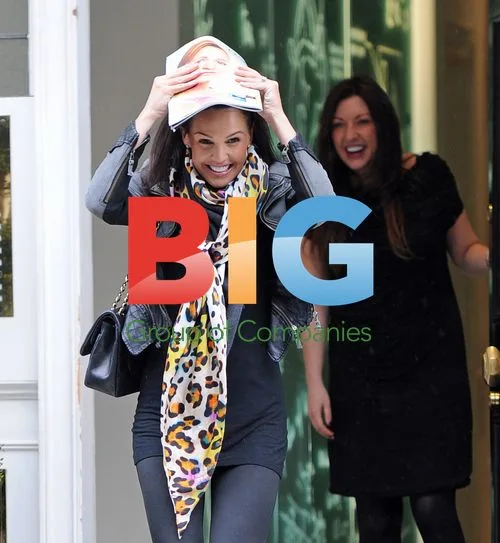 Danielle Lloyd Flashes Teeth at Clinic