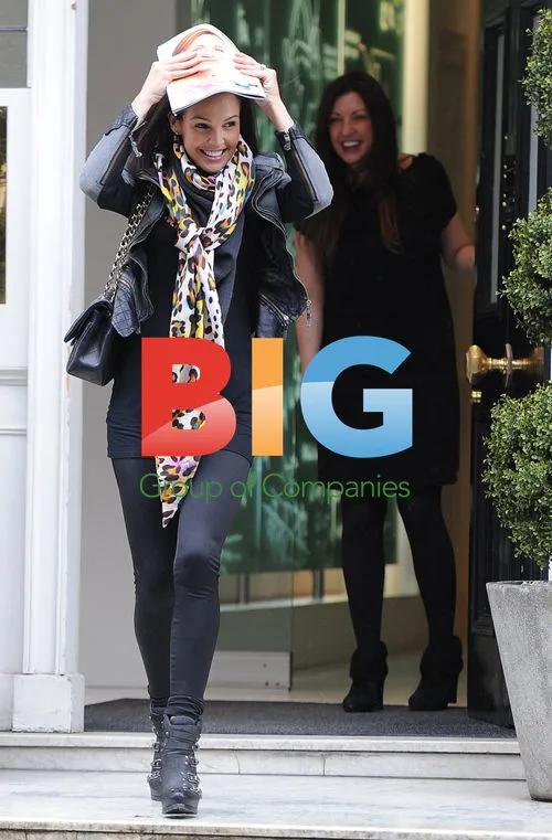 Danielle Lloyd Shows Off New Teeth at Rainy Clinic Visit