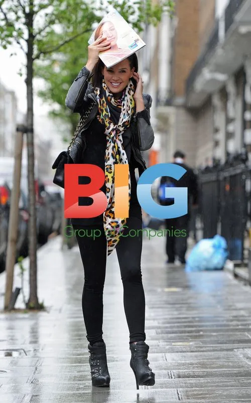 Danielle Lloyd Shows Off New Teeth in Rain