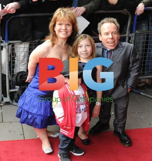 Warwick Davis with family at We Will Rock You 10th anniversary