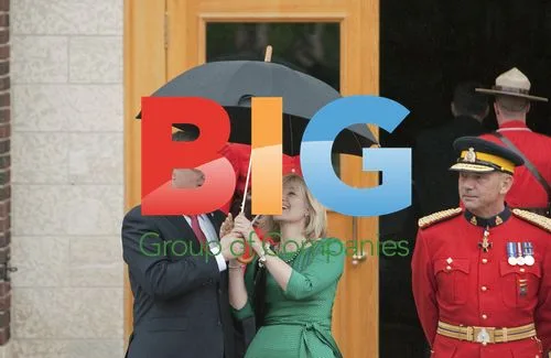 PM Harper and wife with umbrella at Royal Tour