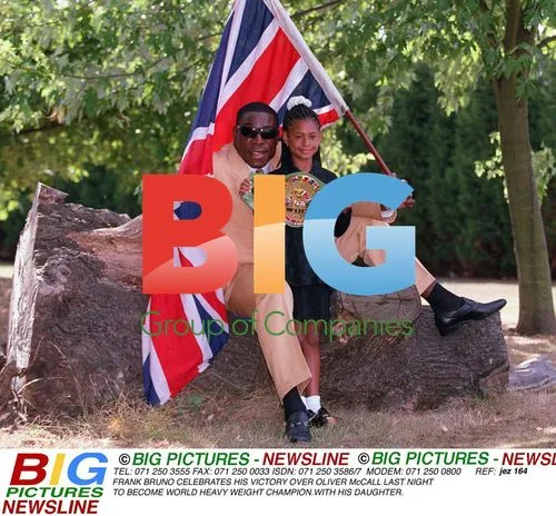 Frank Bruno Shows Off WBC Belt with Daughter