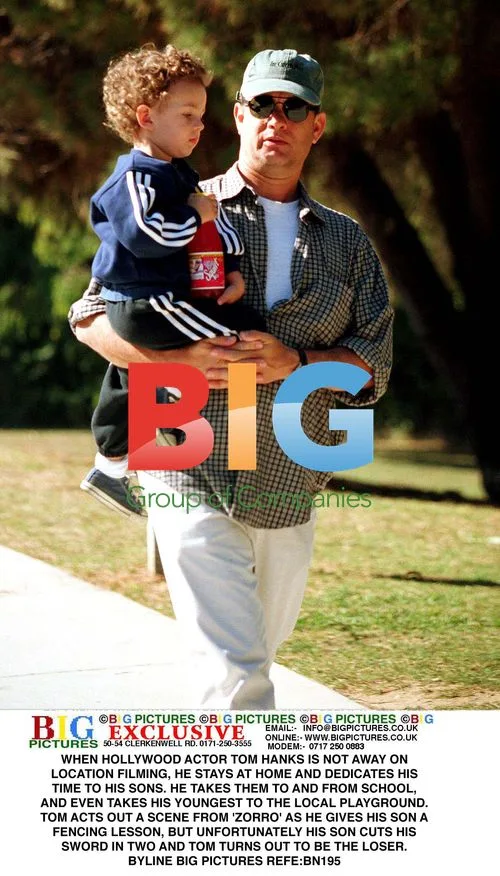 Tom Hanks Plays with Son at Playground