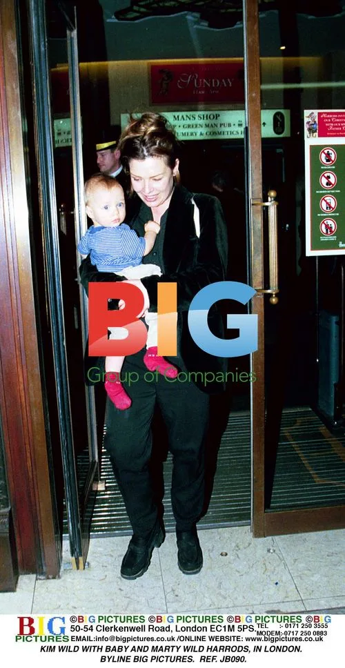 Kim Wild with baby at Harrods in London