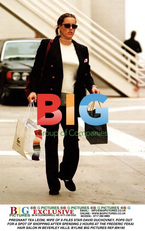 Pregnant Tea Leoni Out Shopping in Beverly Hills