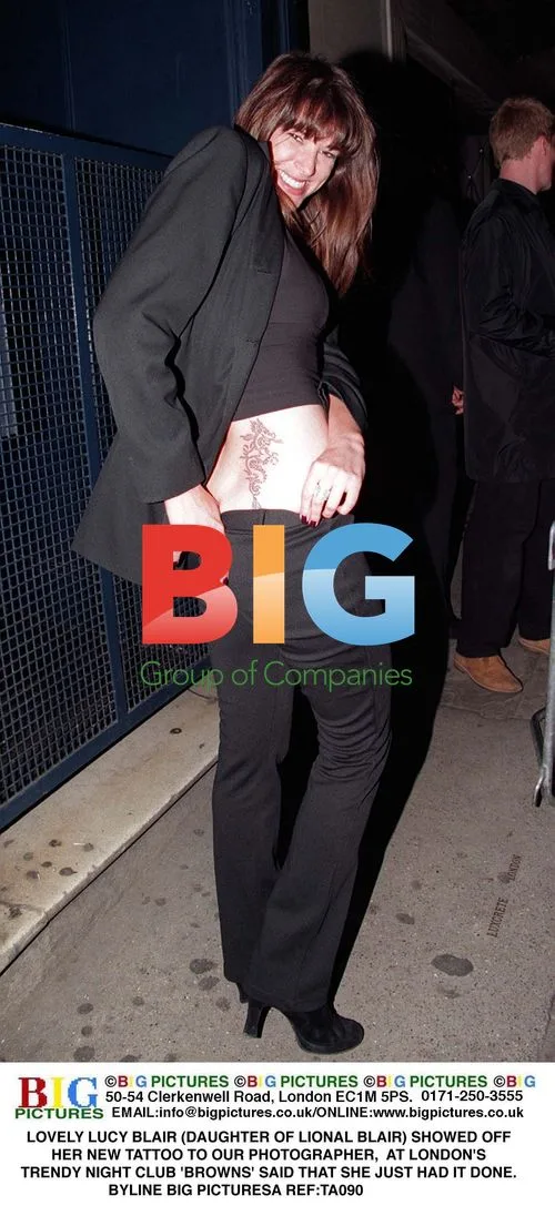 Lucy Blair Shows Off Tattoo at London Club