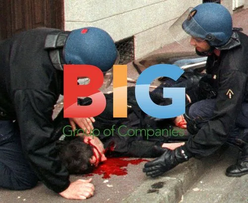 French riot police care for injured colleague