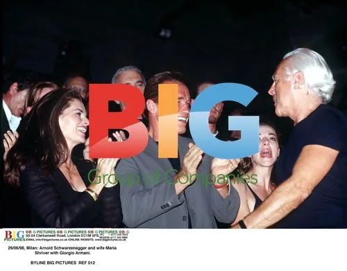 Arnold Schwarzenegger and Maria Shriver with Giorgio Armani