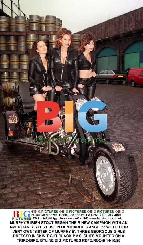 Three Models in Tight PVC Suits on Trike-Bike