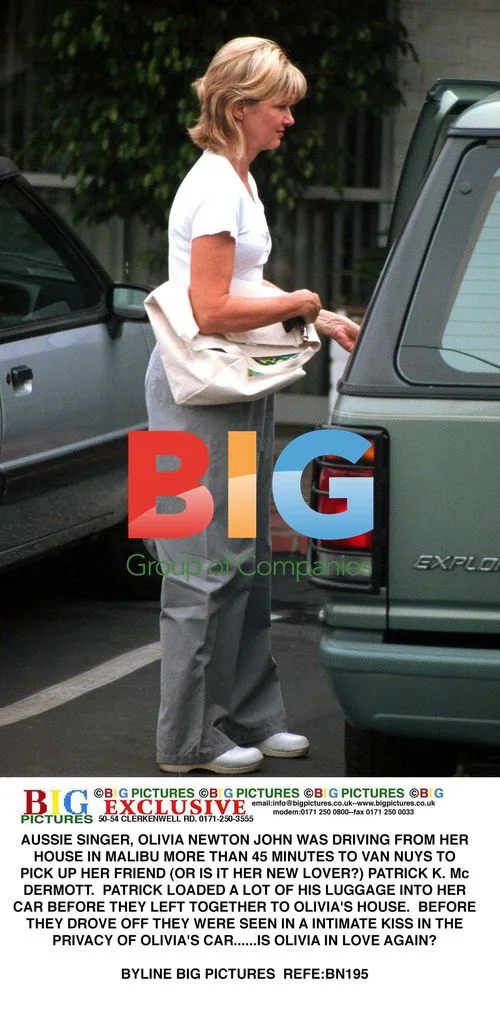 Olivia Newton-John Seen With Mystery Male Companion