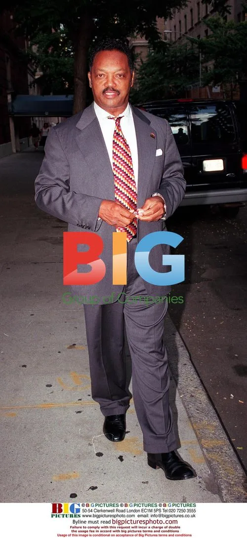 Jesse Jackson leaving Revlon meeting