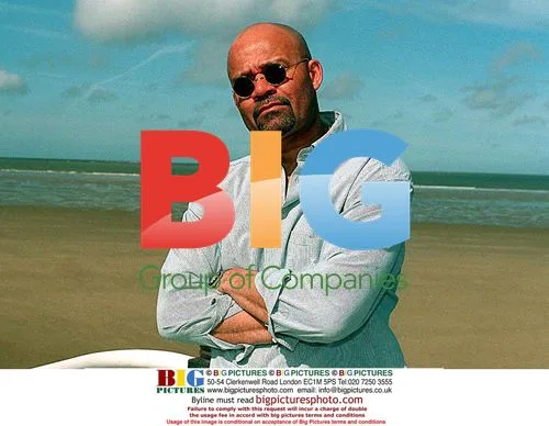 Louis Emerick Poses at Beach
